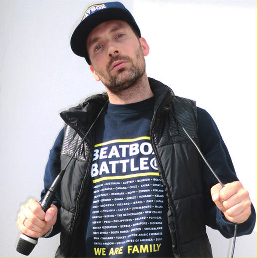 Bee Low the Human Beatbox Artist is posing with an AKG Beatbox Battle DFive microphone over his shoulder in Basel, Switzerland