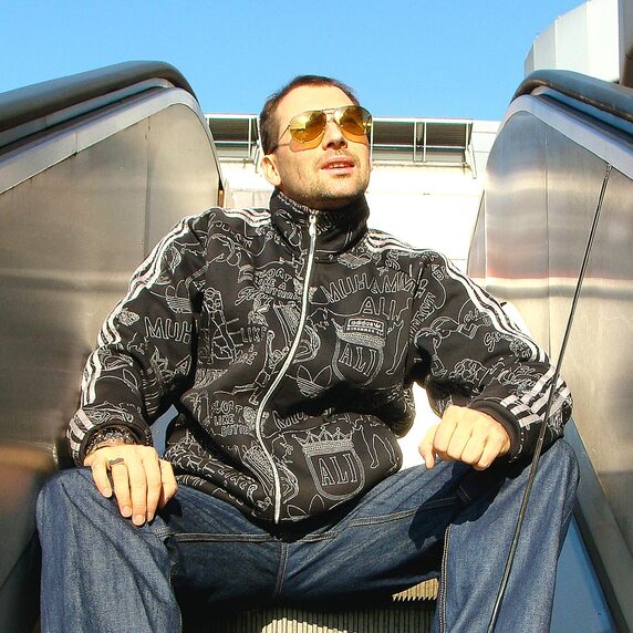 Bee Low the urban culture activist is sitting on a escalator of the ICC bridge at the Messedamm in Berlin-Westend