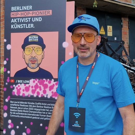Bee Low the Video Creator is standing next to his exhibition booth at the YouTube festival brandcast around the Station Berlin Expo area in Berlin-Kreuzberg